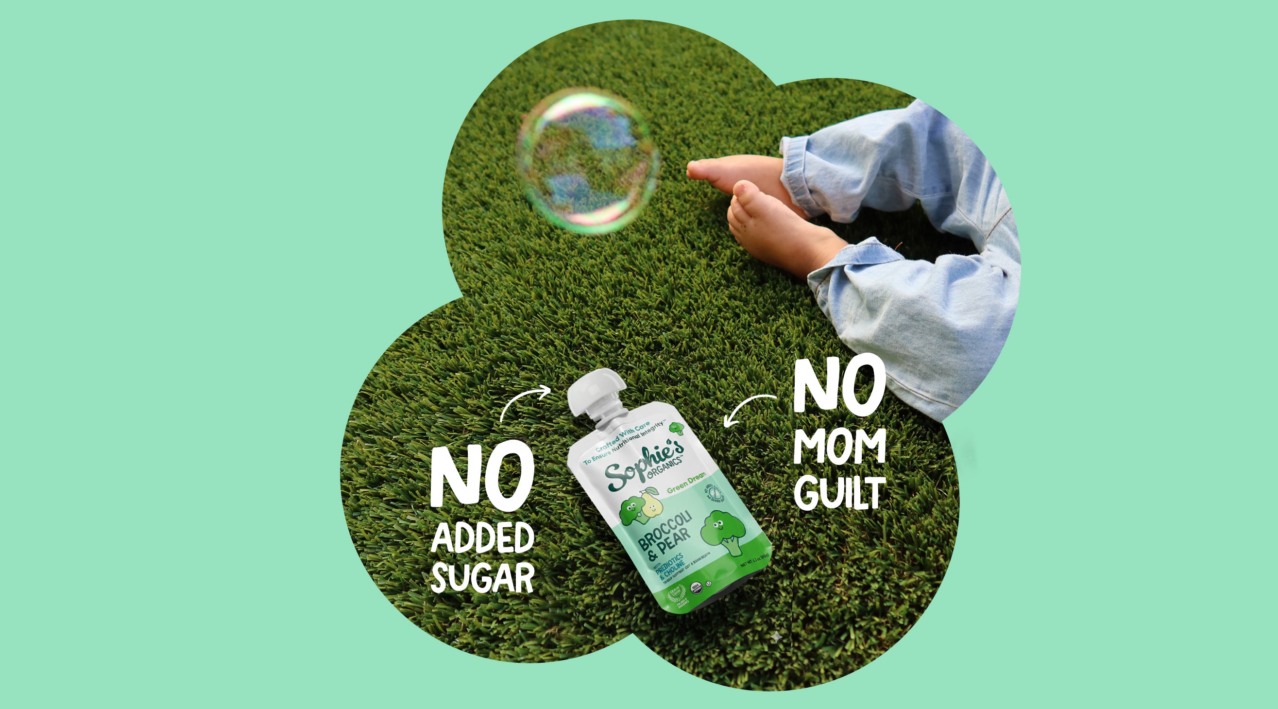 Sophie's Organics Green Dream organic baby food pouch on grass - no added sugar, with broccoli and pear.